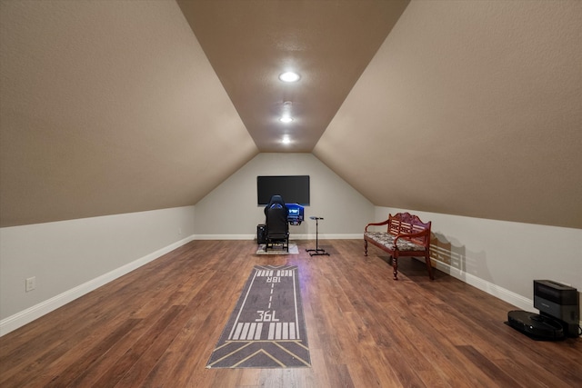 bonus room featuring lofted ceiling and hardwood / wood-style floors