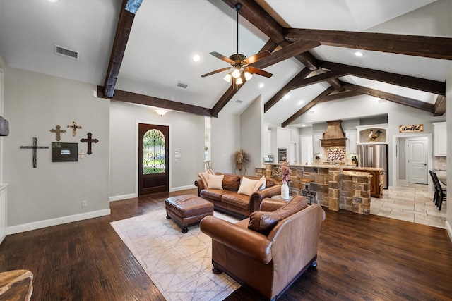 living room featuring ceiling fan, vaulted ceiling with beams, and tile patterned floors