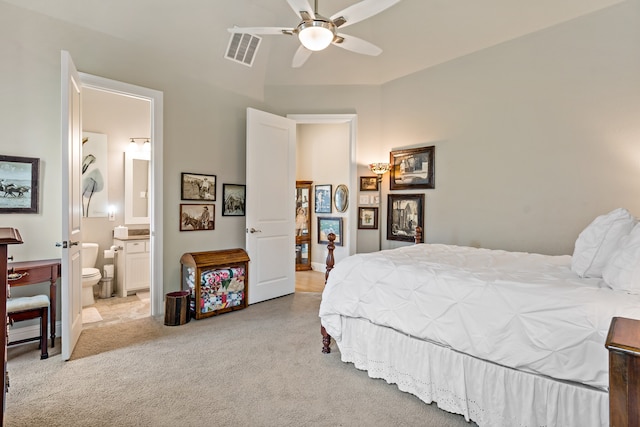 carpeted bedroom featuring ensuite bathroom and ceiling fan