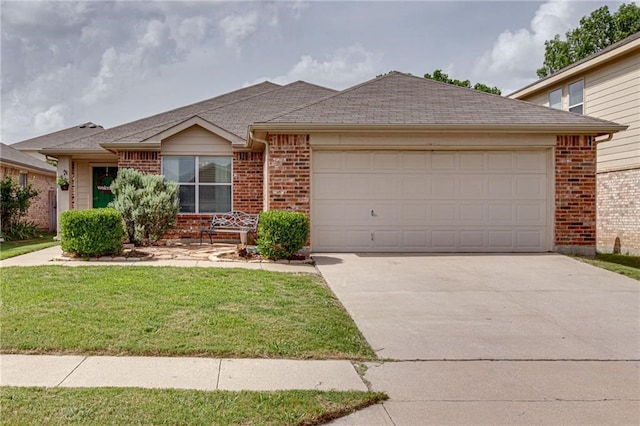 view of front of house with a garage and a front yard