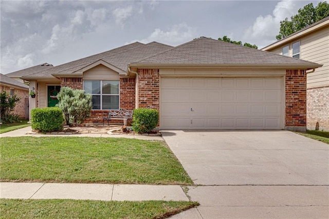 ranch-style house featuring a garage, concrete driveway, brick siding, and a front yard