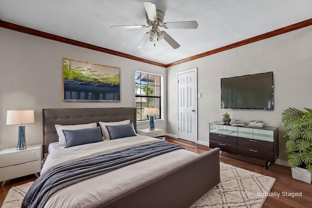 bedroom with ceiling fan, baseboards, crown molding, and wood finished floors