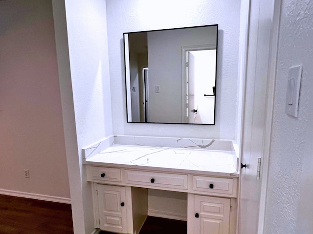 bathroom featuring hardwood / wood-style flooring and vanity