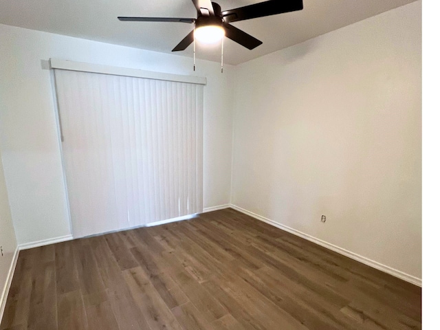 unfurnished room featuring ceiling fan and hardwood / wood-style floors