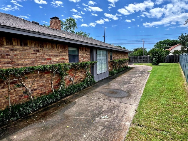 view of home's exterior with a lawn