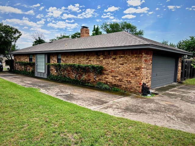 view of property exterior with a garage and a lawn