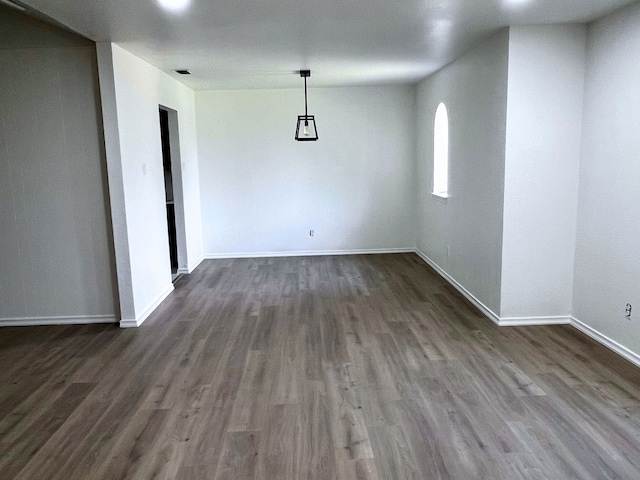 unfurnished room featuring hardwood / wood-style flooring