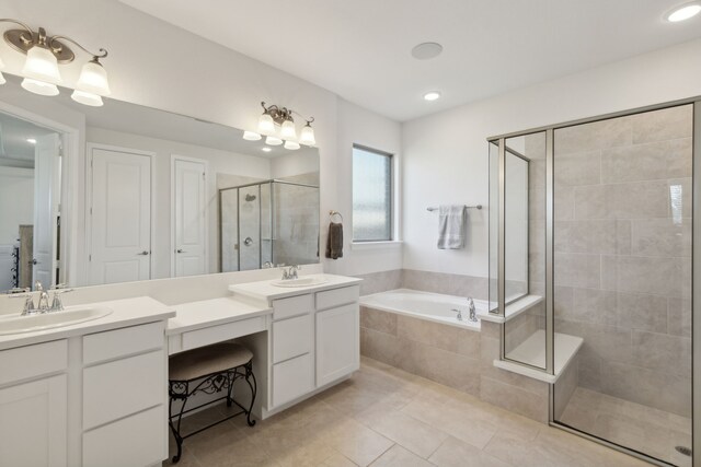 bathroom featuring tile patterned flooring, plus walk in shower, and vanity