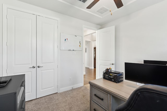 office with ceiling fan and light carpet