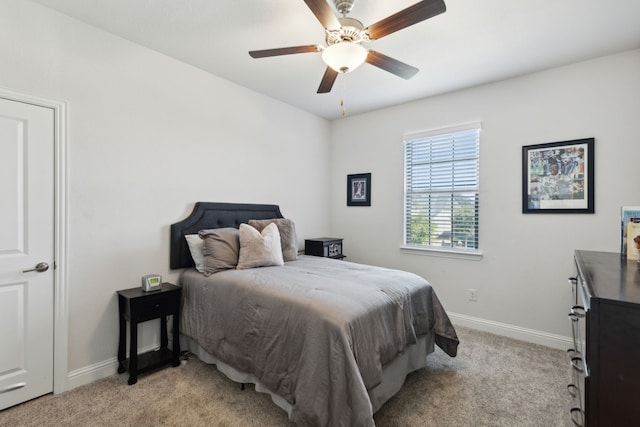 bedroom with light colored carpet and ceiling fan