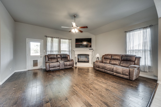 living room featuring ceiling fan and dark hardwood / wood-style flooring