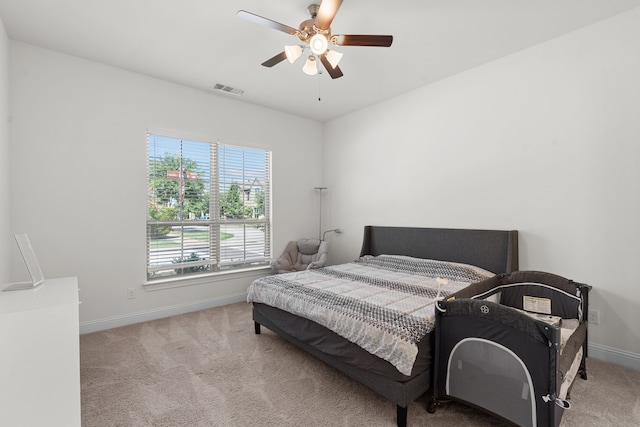 carpeted bedroom with ceiling fan