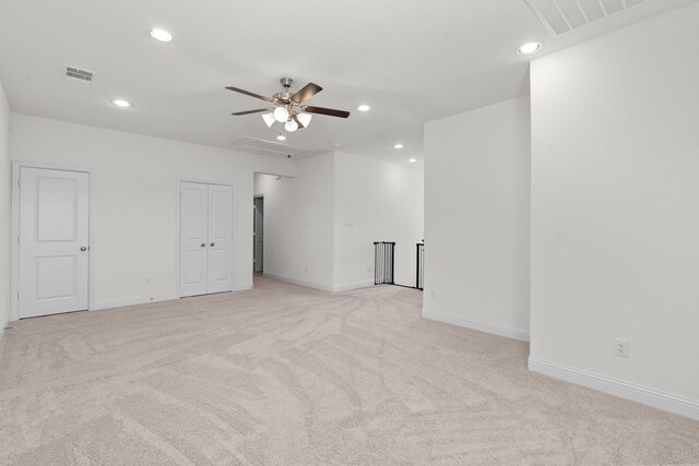 unfurnished bedroom featuring ceiling fan and light carpet