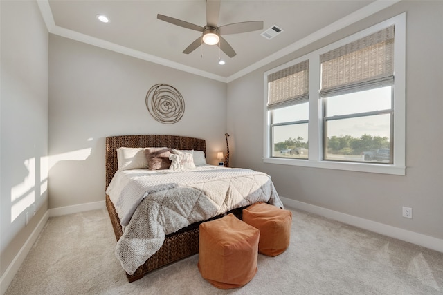 bedroom featuring crown molding, light carpet, and ceiling fan