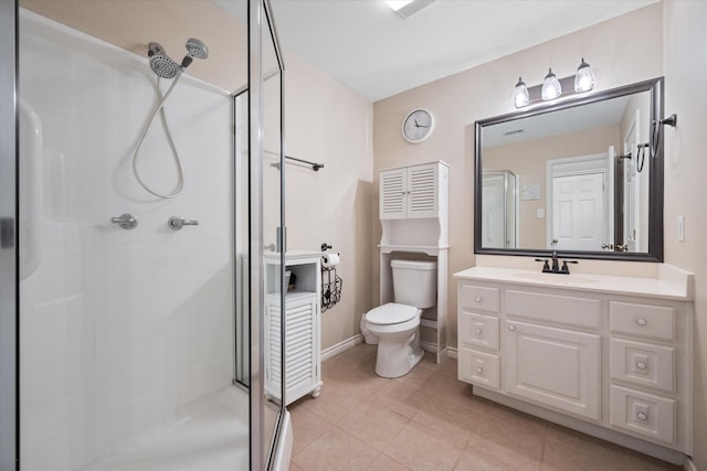 full bathroom with baseboards, toilet, tile patterned flooring, vanity, and a shower stall