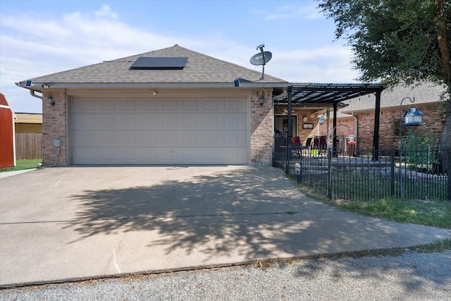 view of front of home featuring a garage, brick siding, fence, and driveway