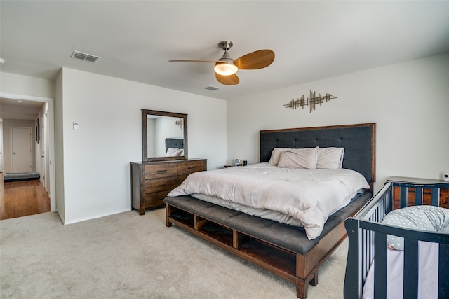 carpeted bedroom with ceiling fan