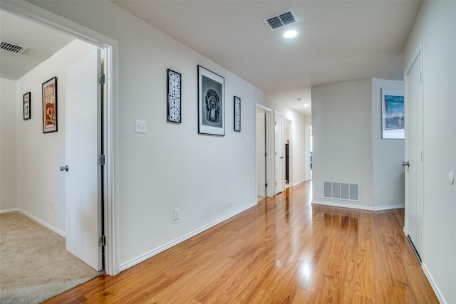 hallway with light wood-type flooring