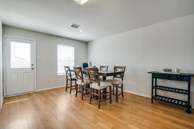 dining space featuring light wood-type flooring