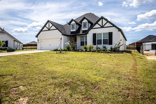 view of front of house with a front yard and a garage