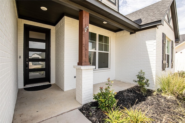 property entrance featuring covered porch