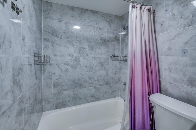 bathroom with shower / bath combo and toilet