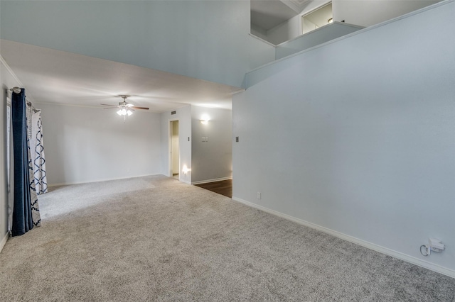 unfurnished room featuring baseboards, a ceiling fan, and carpet flooring