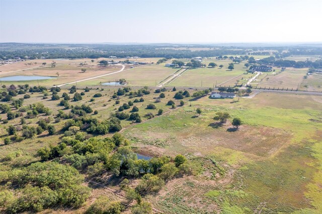 bird's eye view with a rural view and a water view