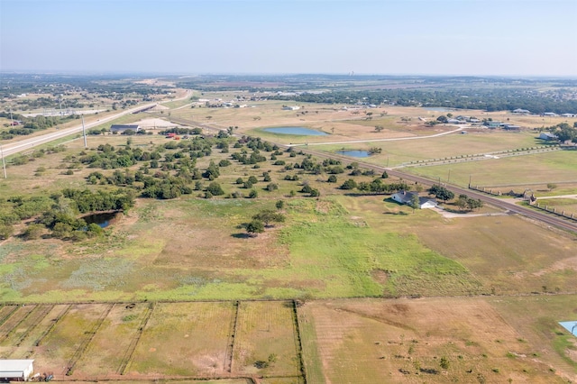 bird's eye view with a rural view and a water view