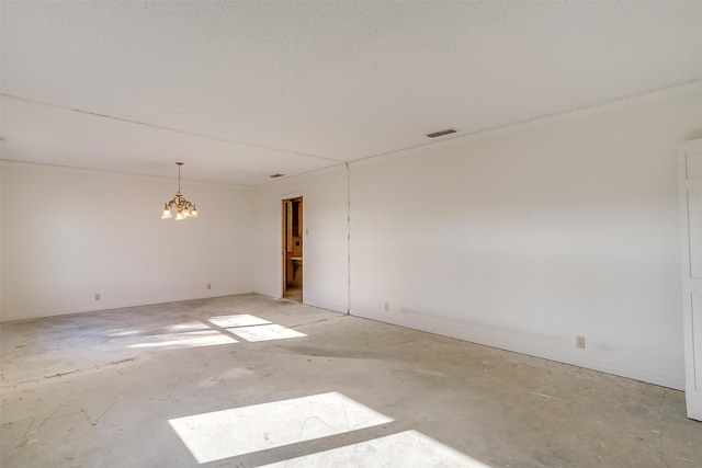 unfurnished room with a notable chandelier