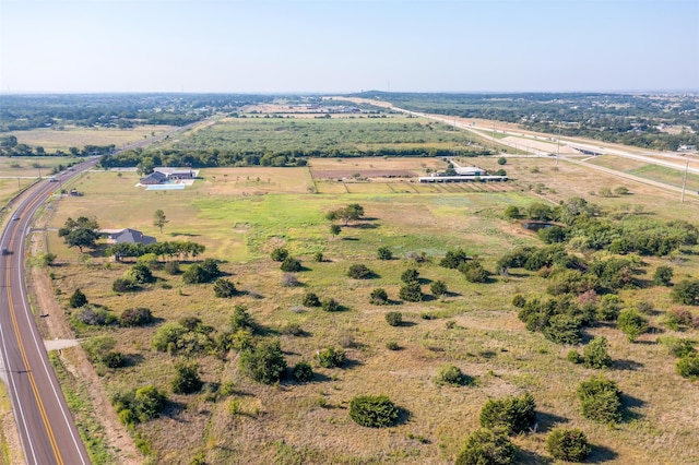 birds eye view of property with a rural view