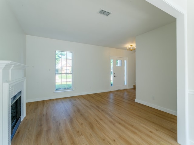 unfurnished living room featuring light hardwood / wood-style flooring