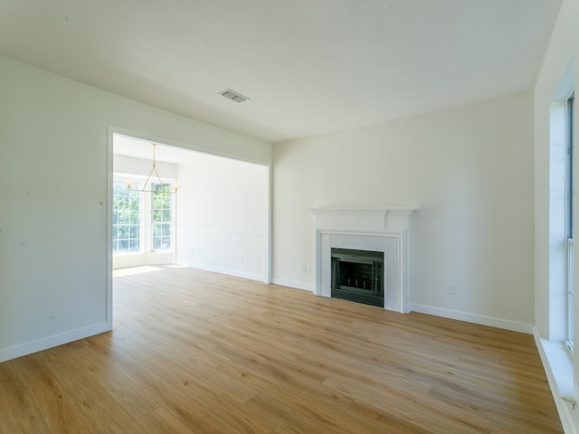 unfurnished living room featuring light hardwood / wood-style floors