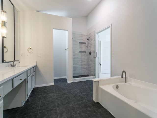 bathroom with tile patterned flooring, separate shower and tub, and vanity