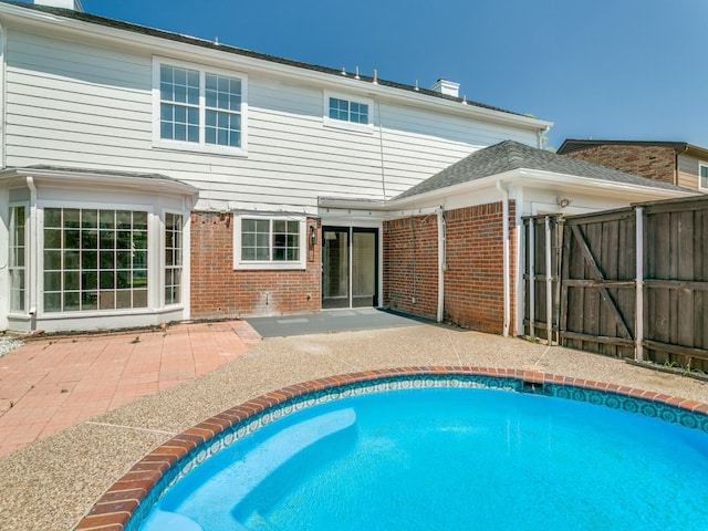 view of swimming pool featuring a patio area