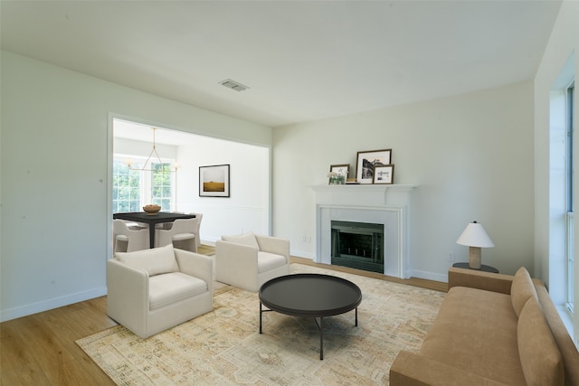 living room with light hardwood / wood-style flooring