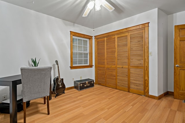 office area with ceiling fan and light hardwood / wood-style floors