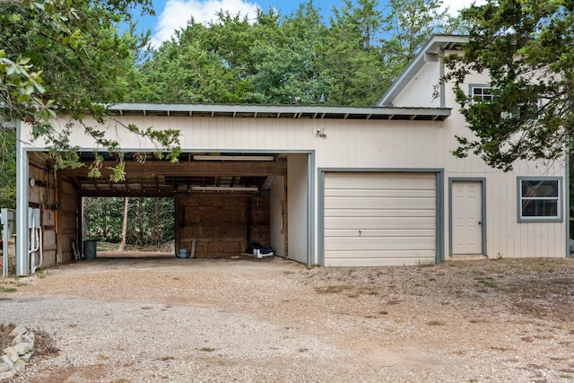 garage featuring a carport