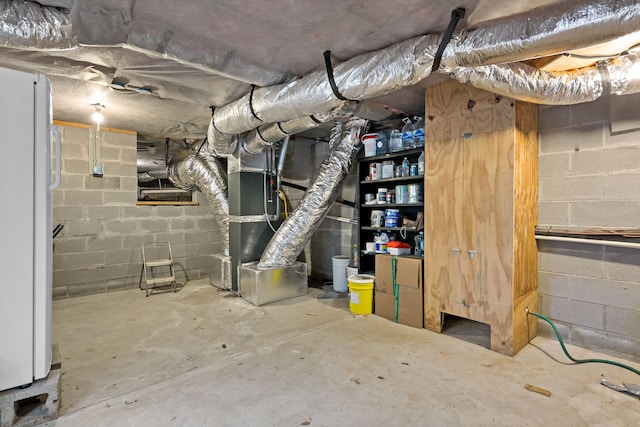 basement with white fridge