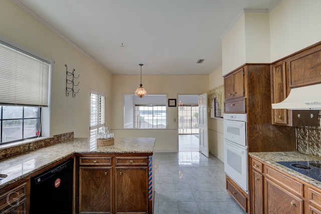 kitchen featuring pendant lighting, custom exhaust hood, kitchen peninsula, black appliances, and crown molding