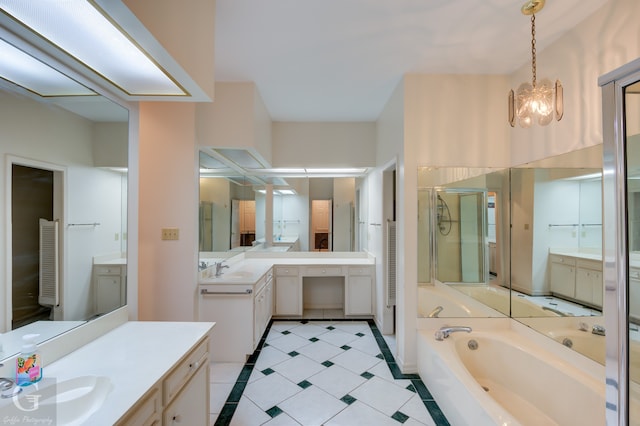 bathroom with vanity, shower with separate bathtub, and a notable chandelier