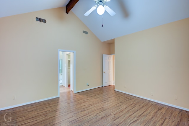 spare room with ceiling fan, beamed ceiling, light hardwood / wood-style flooring, and high vaulted ceiling