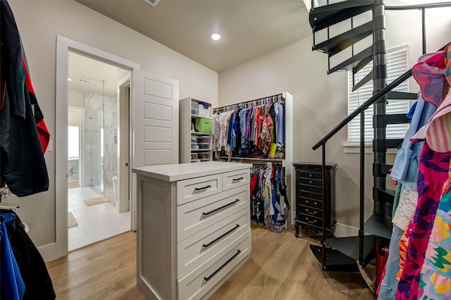 spacious closet featuring light wood-type flooring