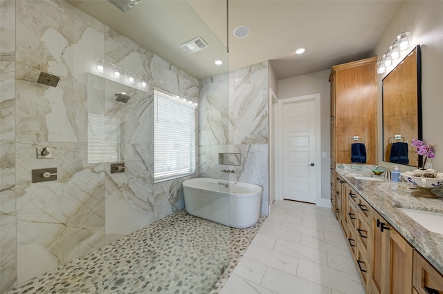 bathroom featuring tile walls, independent shower and bath, vanity, and tile patterned floors