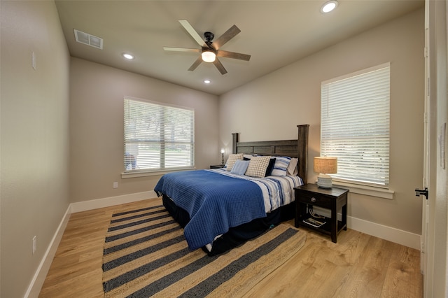 bedroom featuring light hardwood / wood-style flooring and ceiling fan