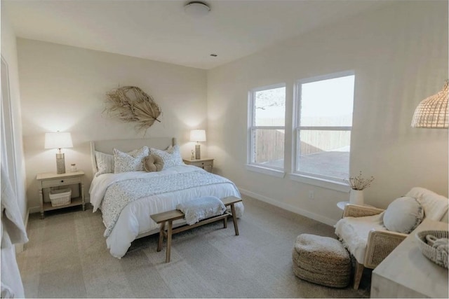 bedroom featuring light carpet