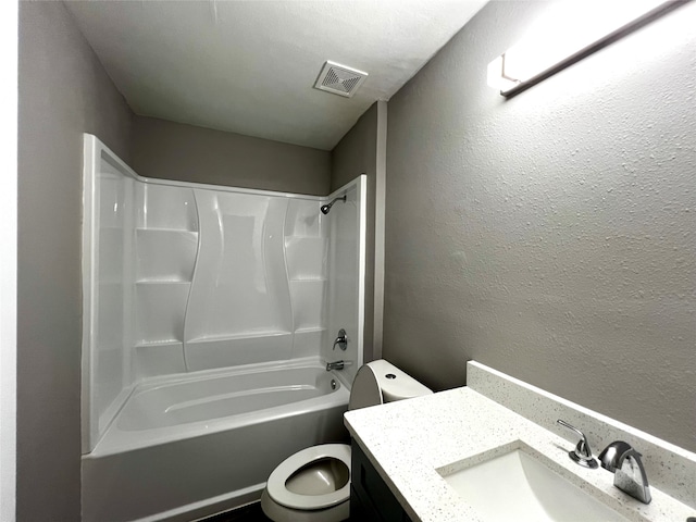 full bathroom featuring toilet, vanity, and bathtub / shower combination