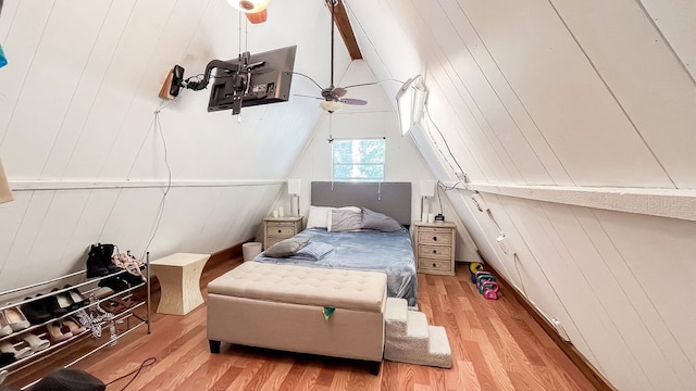 bedroom featuring ceiling fan, vaulted ceiling, and light hardwood / wood-style floors