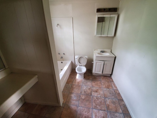 bathroom featuring a bathing tub, toilet, tile patterned flooring, and vanity