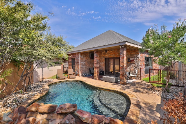 view of pool featuring ceiling fan and a patio area